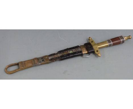 A 19thC African&nbsp;tribal Tuareg or Berber dagger&nbsp;with copper, white metal and brass hilt, inlaid wooden grip in brass