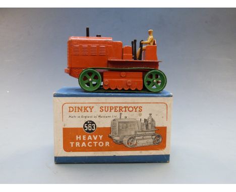 Dinky Supertoys diecast model Heavy Tractor with orange body and green tracks, 563, in original box.&nbsp;