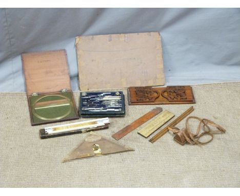 A quantity of draughtsman's equipment including curves, large 19thC brass protractor, 19thC fretwork book slide etc