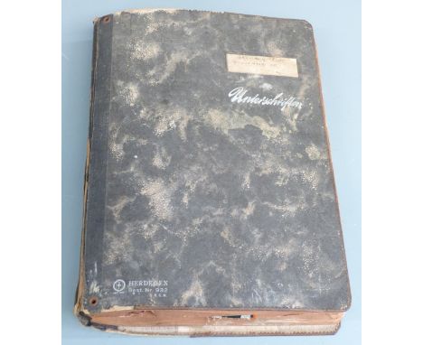 German Third Reich Nazi album containing cloth arm bands/insignia for Army, Air Force and Merchant Navy together with shoulde