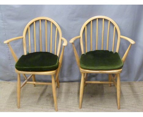 A pair of retro light elm Ercol armchairs