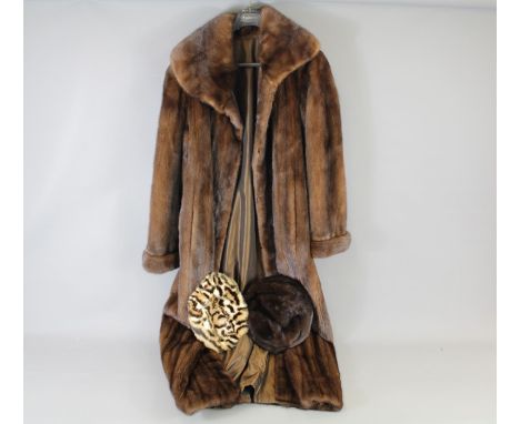 A Full Length Beaver Fur Coat. The coat approx 120 cms, size M together with two fur hats.