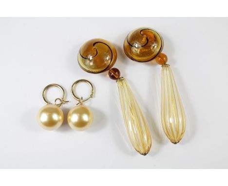 A Pair of 1960's Amber Glass Earrings. This lot includes another pair of faux pearl earrings on 14ct yellow gold backs, appro