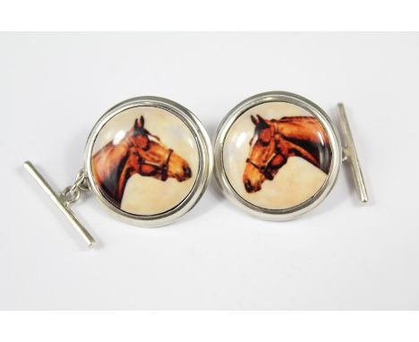 A Pair of Silver and Enamel Equine Portrait Cufflinks. The cufflinks depicting horses.