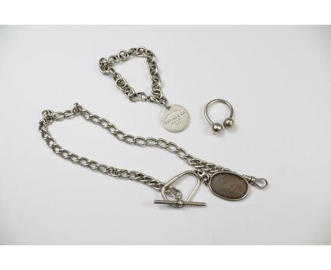 A Silver Bracelet with Tiffany NY medallion, dated 2009 together with a silver Gucci key-fob and a Tiffany &amp; Co key fob (