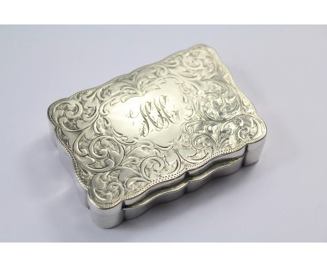 An Early 20th Century Silver Snuff Box. The box with engine-turned foliate decoration, Birmingham hallmark, dated 1902, mm Jo