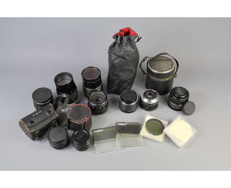 A Quantity of Camera Lens. This lot includes Hoya HMC Tele-Auto f=135mm 1:28, a Hoya Auto Zoom Lens 55mm nr 37906968, a Penta