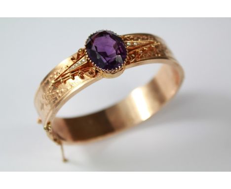 A Victorian 14ct Rose Gold Amethyst and Seed Pearl Bracelet. The bracelet set with a center amethyst in a fine claw setting, 