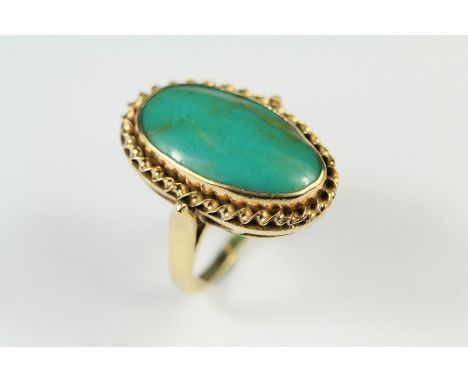 A 14ct Yellow Gold Turquoise-Style Cameo Ring. The ring size J, approx 9.5 gms. (stone unknown)