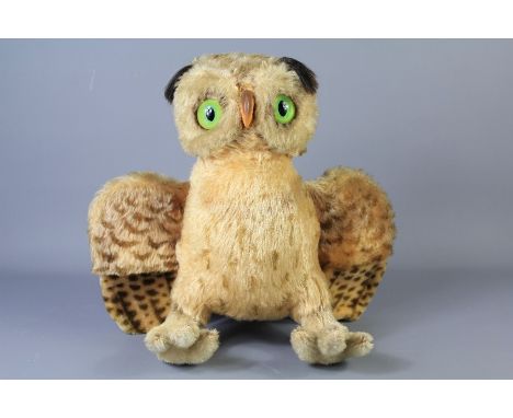 A Large 1950's Steiff 'Wittie' Owl. The mohair plush owl with green glass eyes and rubber beak, 33 cms wingspan and&nbsp;butt