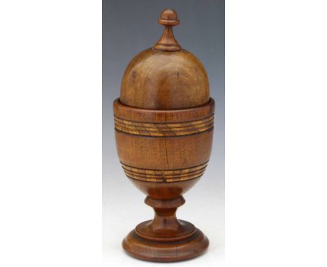 Turned wood pin cushion in the form of a cup and cover, height 25cm Condition report: see terms and conditions