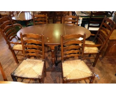 Reproduction oak gate-leg dining table and six ladder-back dining chairs (2 carvers). Condition report: see terms and conditi