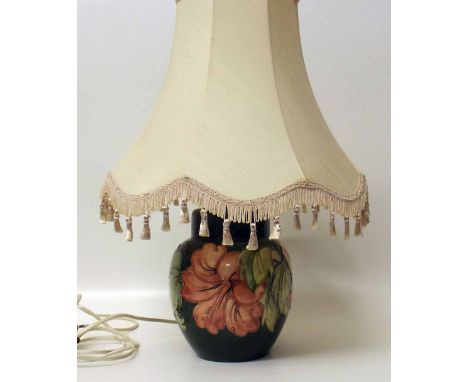 Moorcroft lamp complete with shade. Condition report: see terms and conditions