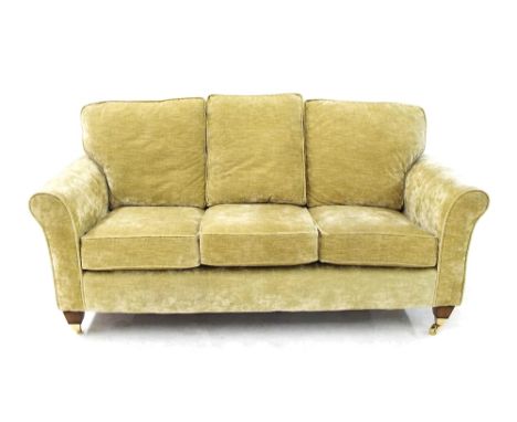 Attractive three seater sofa upholstered in champagne velours fabric, 68" long x 33" high and 34" deep