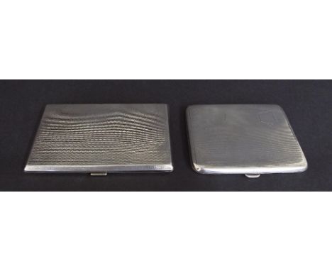 Two similar engine turned silver cigarette cases, 5" and 4" long respectively, 10oz approx (2)