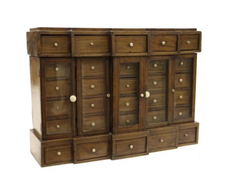 Walnut apprentice/specimen table top breakfront cabinet, with five rows of five banks of small drawers behind glass doors, fl