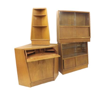 Early G Plan E. Gomme oak corner display cabinet, comprising two glazed cupboards, further corner shelf and centre corner uni