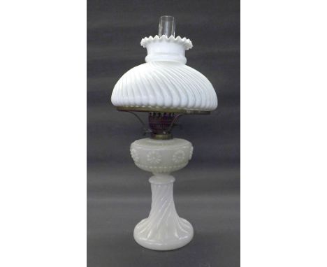 Moulded opaline glass oil lamp with wrythen fluted shade and stand, 23" high