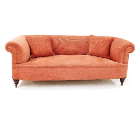 Victorian two seater Chesterfield sofa with salmon corduroy upholstery upon turned front legs and brass castors, 72" long x 2