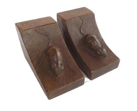 Pair of Arts & Crafts 'Mouseman' oak bookends, each carved with a mouse on an arched slope, 6.25" long