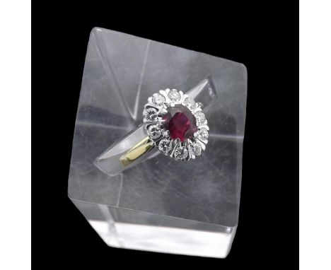 18ct ruby and diamond oval cluster ring, the oval ruby of good colour within a surround of round brilliant-cut diamonds set i