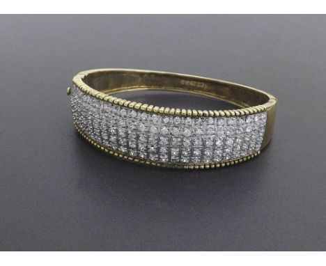 (010714) 9ct gold pave cz set bangle, 37.4gm, 68mm wide