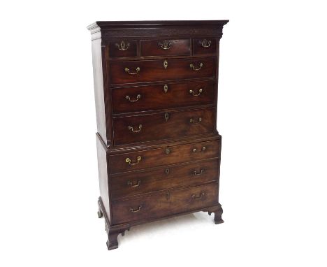 George III mahogany chest on chest, the top with blind fretwork scrolled panel over three short and six long graduated drawer