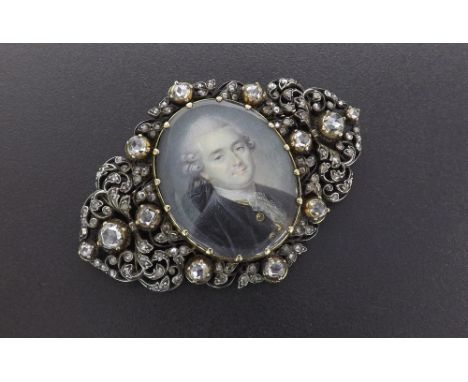 Fine 19th century diamond set brooch, inset with an oval portrait of a gentleman within a pierced foliate scroll surround set
