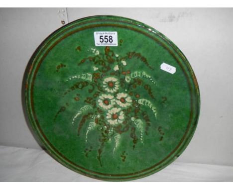 A hand painted ceramic tray.
