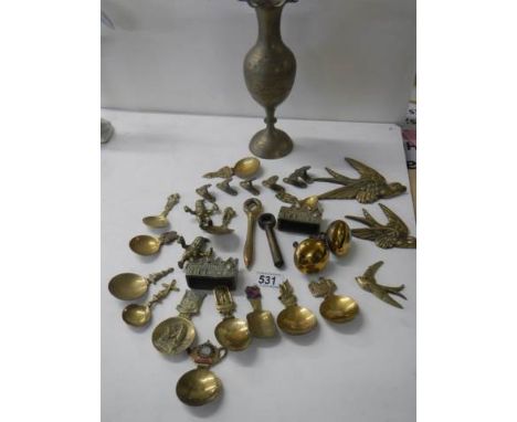 A mixed lot of caddy spoons &amp; brass items etc.