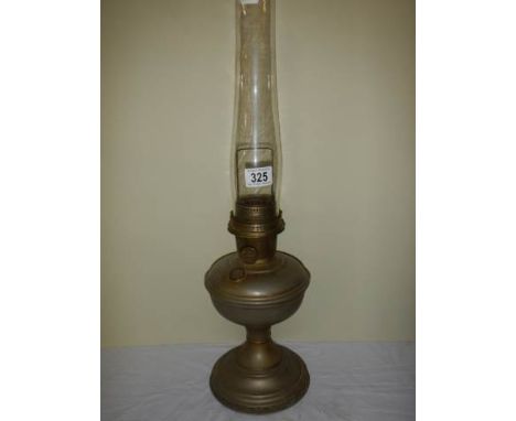 A brass oil lamp with chimney. 