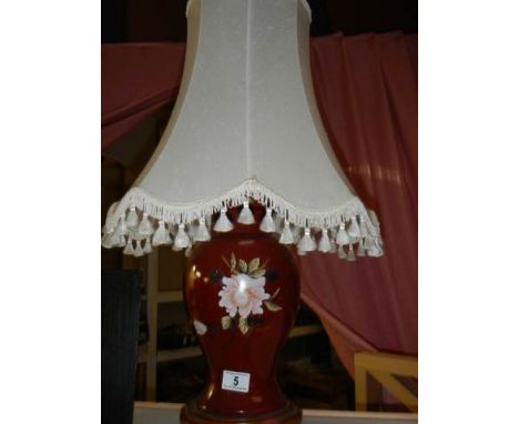 A pottery table lamp with shade. 