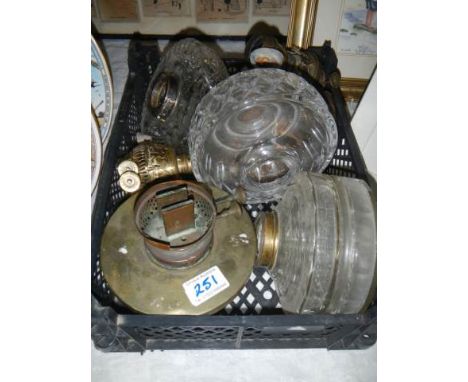 A quantity of oil lamp fonts etc., 