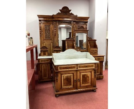 A XIX Century Walnut Five Piece Bedroom Suite, comprising: breakfronted wardrobe with central mirror and flanking cupboard do