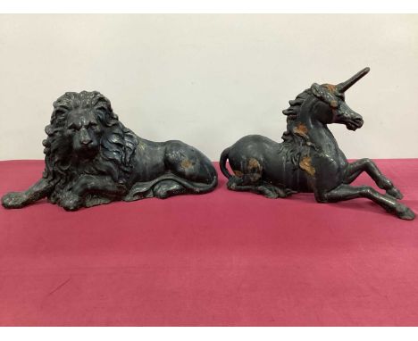 A Late XIX Century Black Painted Cast Iron Model of a Unicorn and another of a Lion, 62 and 68cm long. (2)