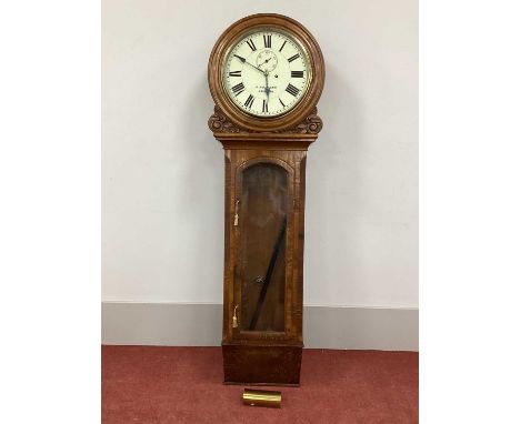 A Late XIX Century Drop or Tavern Clock, the oak cased trunk with glazed door and circular white enamel dial with Roman numer