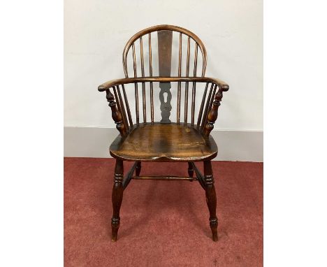 A XIX Century Ash and Elm Windsor Chair, with hooped back and rail supports on turned legs united by 'H' stretcher (later spl