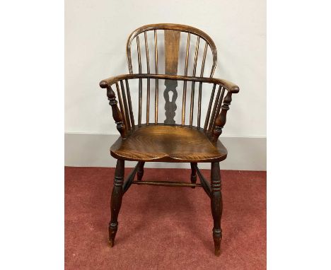 A XIX Century Ash and Elm Windsor Chair, with hooped back and rail supports on turned legs with 'H' stretcher (later splat).