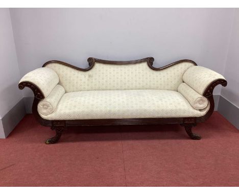 A XIX Century Mahogany Regency Settee, with shaped and reeded top rail, shaped arms and reeded frieze on carved shaped suppor