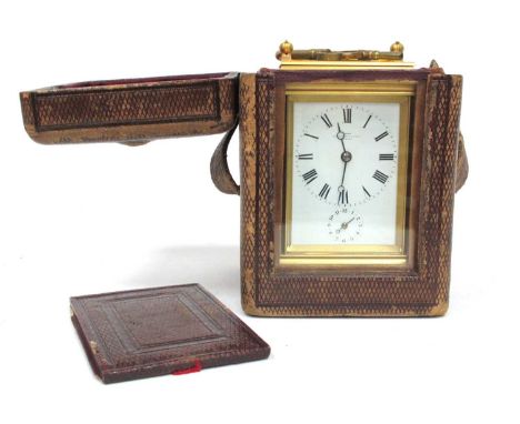 A Late XIX Century Gilt Brass Carriage Clock, with push button repeat, the white enamel dial inscribed "Dent, Cockspurr Stree