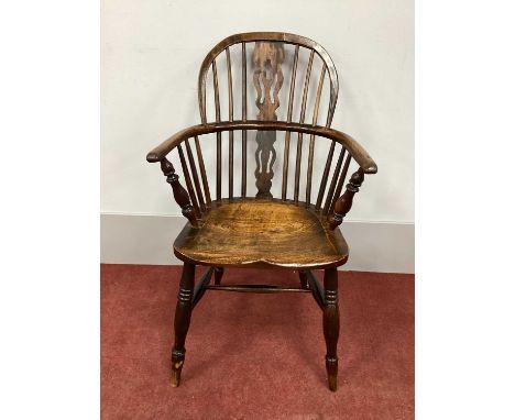 A XIX Century Ash and Elm Windsor Chair, with hooped back and pierced splats on turned legs united by 'H' stretcher.