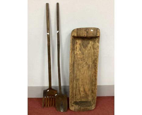 A XIX Century Carved Wood Pig Salting Trough, 118cm long and an agricultural spade and fork. (3)