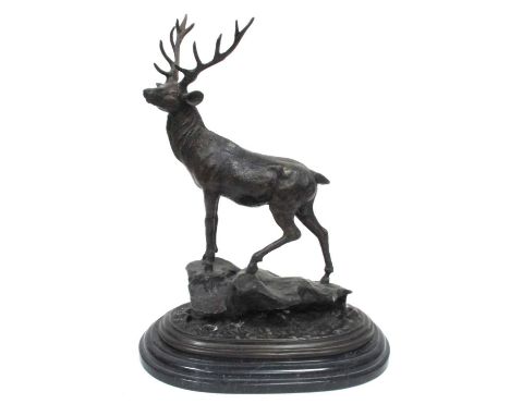 AFTER PIERRE JULES MENE (1810-1879); A Bronze Model of a Stag, stood atop a rocky outcrop, raised on a stepped black oval mar