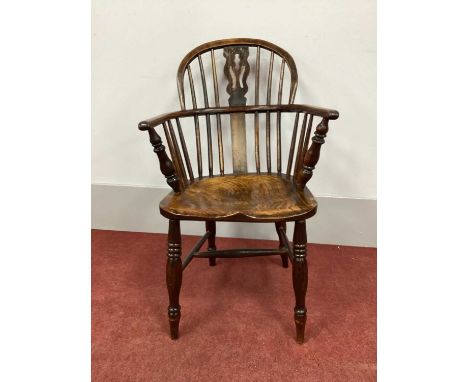 A XIX Century Ash and Elm Windsor Chair, with hooped back and pierced splat on turned legs with 'H' stretcher (with alteratio