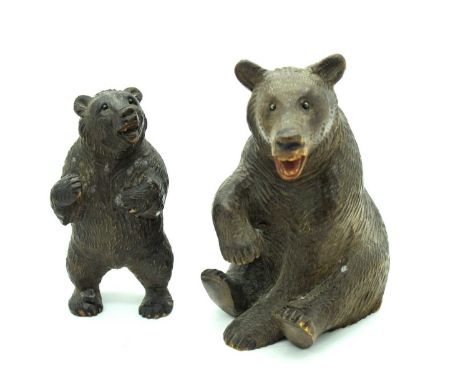 An Early XX Century Black Forest Seated Bear, 10cm high, with another standing. (2)