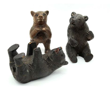 An Early XX Century Black Forest Seated Bear,10cm high, a standing bear and a recumbent bear. (3)