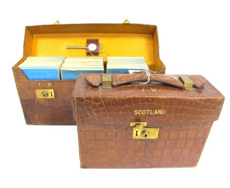 An Edwardian Pair of Cased Sets of Bartholomew's Road Maps for England and Wales and Scotland, in brown crocodile skin cases,