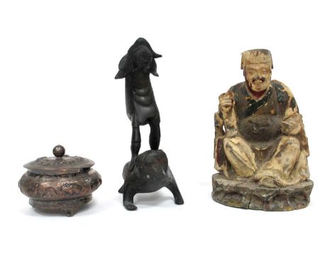 A Chinese Bronze Figure of a Boy Standing on a Toad, 19cm high, a Chinese white metal trinket box and cover cast with animals