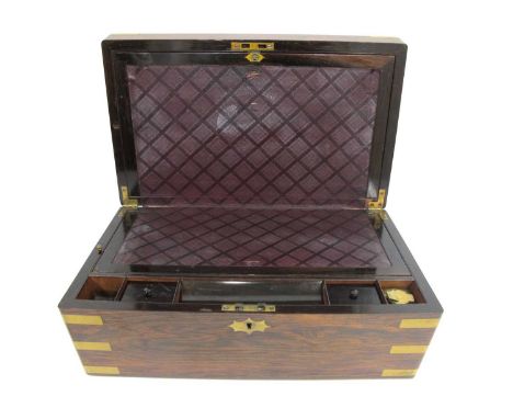 A Late XIX Century Rosewood and Brass Bound Writing Slope, with leatherette skiver, pen tray, inkwell, hidden drawer etc., 25