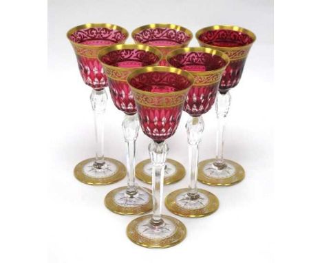 A Set of Six St Louis, France Glass Goblets, the cranberry flashed bowl with cut decoration and gilt scrolling bands, etched 